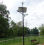 Lampa hybrydowa LED 2x30W / panel 275W / turbina 300W / słup 6m / aku 150Ah